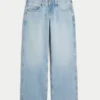 Lavtaljede, lysvaskede baggy jeans med nitter og sløjfer Lavtaljede, lysvaskede baggy jeans med nitter og sløjfer