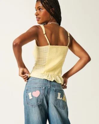 Lavtaljet baggy jeans med medium vask og Los Angeles-grafik