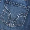 Lavtaljet mini-skort i denim med nitter Lavtaljet mini-skort i denim med nitter