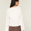 Let langærmet babydoll-top med flæser Let langærmet babydoll-top med flæser