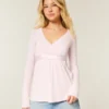 Let langærmet babydoll-top med kryds foran Let langærmet babydoll-top med kryds foran