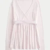Let langærmet babydoll-top med kryds foran Let langærmet babydoll-top med kryds foran