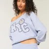 Let off-shoulder NYC grafisk sweatshirt Let off-shoulder NYC grafisk sweatshirt