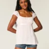Let satin babydoll-top med bindebånd Let satin babydoll-top med bindebånd