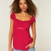 Let satin babydoll-top med bindebånd Let satin babydoll-top med bindebånd