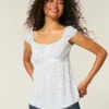 Let satin babydoll-top med bindebånd Let satin babydoll-top med bindebånd