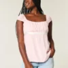 Let satin babydoll-top med bindebånd Let satin babydoll-top med bindebånd