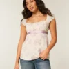 Let satin babydoll-top med bindebånd Let satin babydoll-top med bindebånd