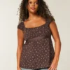 Let satin babydoll-top med bindebånd Let satin babydoll-top med bindebånd
