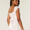 Let satin babydoll-top med bindebånd Let satin babydoll-top med bindebånd