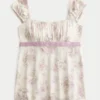 Let satin babydoll-top med bindebånd Let satin babydoll-top med bindebånd