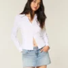 Letvasket mini-skort i denim med nitter Letvasket mini-skort i denim med nitter
