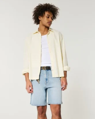 Løse denimshorts over knæet med distressed look