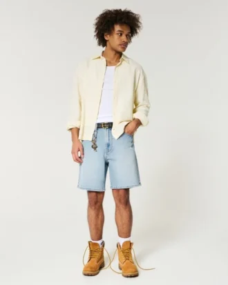 Løse denimshorts over knæet med distressed look