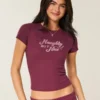 Naughty But Nice grafisk baby-T-shirt Naughty But Nice grafisk baby-T-shirt