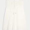 Stropløs babydoll-minikjole med kroget overdel Stropløs babydoll-minikjole med kroget overdel