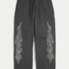 Superbaggy sweatpants med dobbelt flamme-grafik Superbaggy sweatpants med dobbelt flamme-grafik