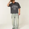 Tung baggy crop Detroit Graphic fodbold-T-shirt Tung baggy crop Detroit Graphic fodbold-T-shirt