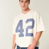 Tung baggy kort fodbold-T-shirt med grafisk print Tung baggy kort fodbold-T-shirt med grafisk print