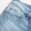Ultra lavtaljede, slidte, lysvaskede jeans med pailletter Ultra lavtaljede, slidte, lysvaskede jeans med pailletter