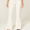 Ultra lavtaljet hvid broderet flare-jeans med lommer Ultra lavtaljet hvid broderet flare-jeans med lommer