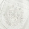Ultra lavtaljet hvid broderet flare-jeans med lommer Ultra lavtaljet hvid broderet flare-jeans med lommer