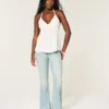 Ultra lavtaljet lysvasket flare jeans med nedadgående kant Ultra lavtaljet lysvasket flare jeans med nedadgående kant