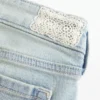 Ultra lavtaljet lysvasket flare jeans med nedadgående kant Ultra lavtaljet lysvasket flare jeans med nedadgående kant